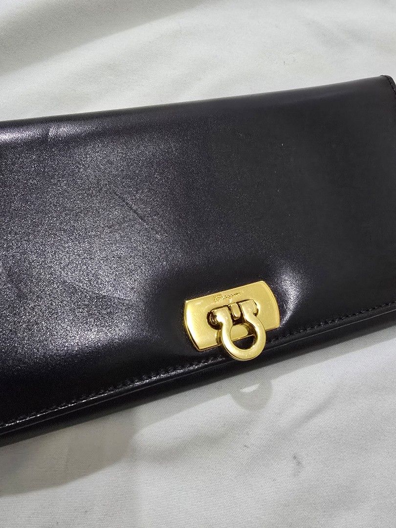 Original Salvatore Ferragamo Long Wallet (Category: Luxury Bags & Wallets) located in Cavite. Submitted by everythingjapan (Listing ID 1408876253, Image 2). Description: original ferragamo wallet almost new BUT WITH FLAWS: sticky coin pocket, cannot use. hence selling very low the wallet can still be used as is without the coin compartment or if u can clean it out or bring to a bag spa for cleaning. no inclusions 4 card slots 1 open pockets bill 