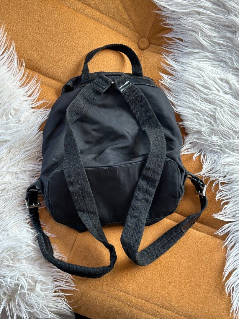 Prada Nylon Backpack 🖤 (Category: Luxury Bags & Wallets) located in San Fernando. Submitted by diorboi_ (Listing ID 1408817287, Image 2). Description: FOR EARLY DIBS! FOR SALE! SUPER SALE🎄💫 📸IG/TikTok: @juzygallery Prada Nylon Backpack 🖤 ABOUT/ISSUE: - 100% authentic 💯 money back guaranteed if proven fake by proffesionals! - comes w/ DB - used condition that’s why selling low - condition can be seen on photos. - magnet is repaired - slight 