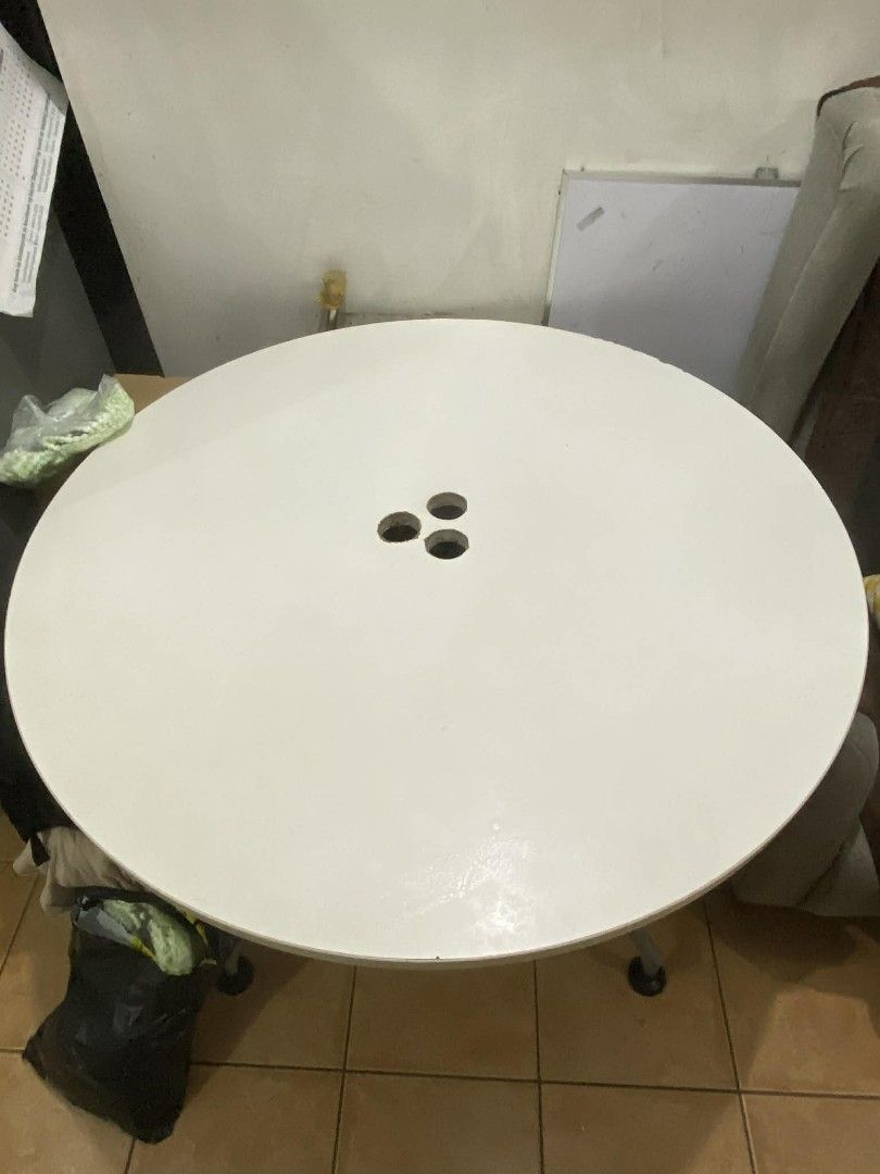 Round White Table (Category: Tables & Sets) located in Manila. Submitted by switchcity (Listing ID 1408738122, Image 1). Description: - Round white table -pw - Simple design - White tabletop with three holes - Metal frame with four legs - Black leg caps - Pwede work table or dining. - Versatile use: dining or workspace.