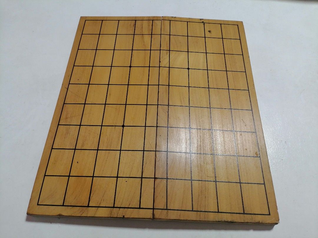 SHOGI BOARD (Japanese Chess) (Category: Board Games & Puzzles) located in San Mateo. Submitted by arrowscrap_delight (Listing ID 1408741530, Image 2). Description: SHOGI BOARD (Japanese Chess ) Good Condition Wood Material Dimensions : 30.5cm x 26.5cm Minor Issue: Dents, Ink Mark & Light Scrathes (last 3 photos) 120 + SF.