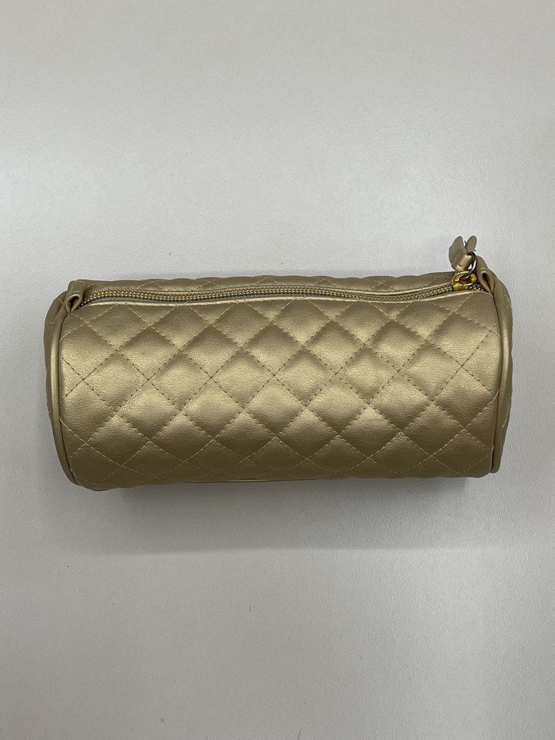 Stila Quilted Cosmetic Pouch - Gold (Category: Makeup) located in Manila. Submitted by shopandscore (Listing ID 1408823711, Image 1). Description: - Stila cosmetic bag - Gold quilted design - Cylindrical shape - Zipper closure - Navy blue interior - Compact size - Ideal for makeup and small essentials.