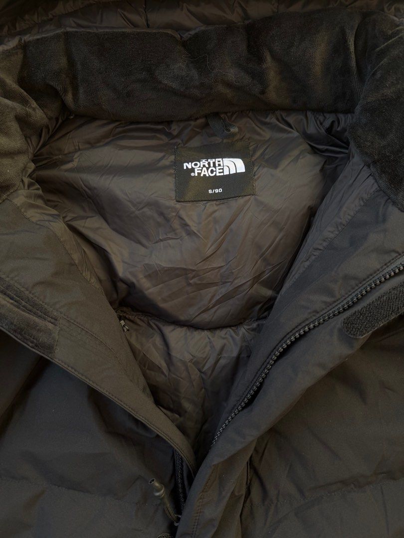 The North Face Long Down Jacket Black (Category: Coats, Jackets and Outerwear) located in Legazpi City. Submitted by tiny0509 (Listing ID 1408761119, Image 3). Description: Black The North Face long down jacket. Features a hood, DryVent technology, and RDS (Responsible Down Standard) certification. Size S/SG. Includes a zip closure and multiple pockets. Perfect for cold weather. Made with 100% polyester. 22x40 dimention may best fit to large.