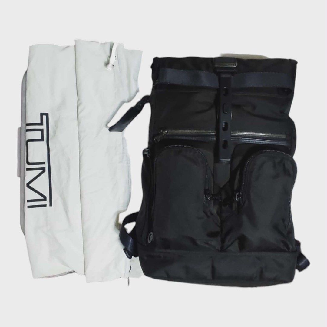 TUMI Alpha Bravo London Roll Top Laptop Backpack (Category: Backpacks) located in Cebu City. Submitted by gabgaaab (Listing ID 1408858836, Image 2). Description: - TUMI Alpha Bravo London Roll Top Laptop Backpack - Roll-top closure - Multiple exterior pockets - Padded laptop compartment - Luggage sleeve - Includes dust bag - Black color - Adjustable shoulder straps - Sleek design, suitable for men and women.