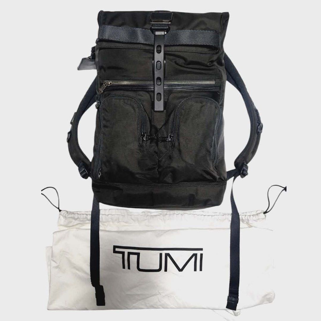 TUMI Alpha Bravo London Roll Top Laptop Backpack (Category: Backpacks) located in Cebu City. Submitted by gabgaaab (Listing ID 1408858836, Image 3). Description: - TUMI Alpha Bravo London Roll Top Laptop Backpack - Roll-top closure - Multiple exterior pockets - Padded laptop compartment - Luggage sleeve - Includes dust bag - Black color - Adjustable shoulder straps - Sleek design, suitable for men and women.