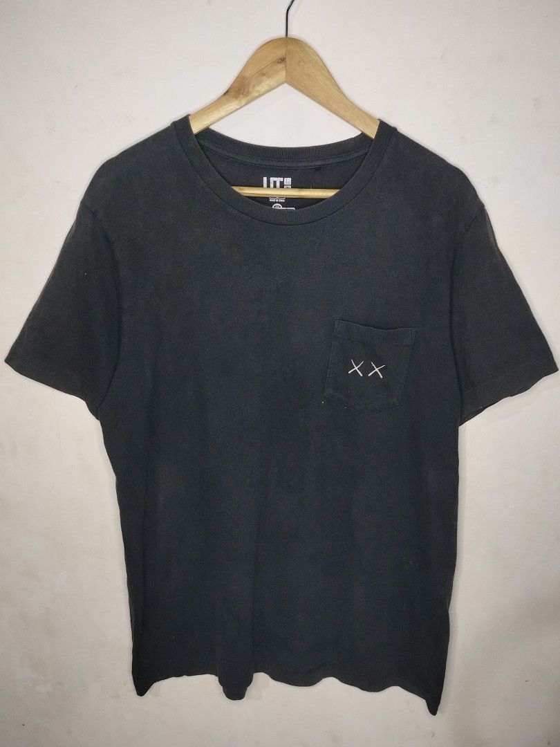 Uniqlo x Kaws Pocket Tee (Category: Tshirts & Polo Shirts ) located in Tacurong. Submitted by jumarvelous (Listing ID 1408792708, Image 1). Description: Excellent Condition No Issue, Needs wash size L on tag, best fit M-L Dimes: 21.5x28 Condition: 10/10.