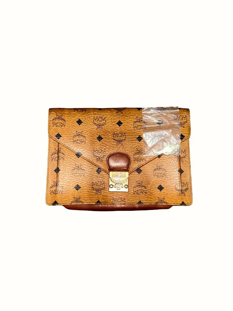 Vintage MCM Visetos Clutch Bag (Category: Luxury Bags & Wallets) located in Taguig. Submitted by mc.bags (Listing ID 1408833415, Image 1). Description: - Vintage MCM Visetos Cognac Brown Clutch Bag - Authentic, from Japan - Comes with keys - negotiable.