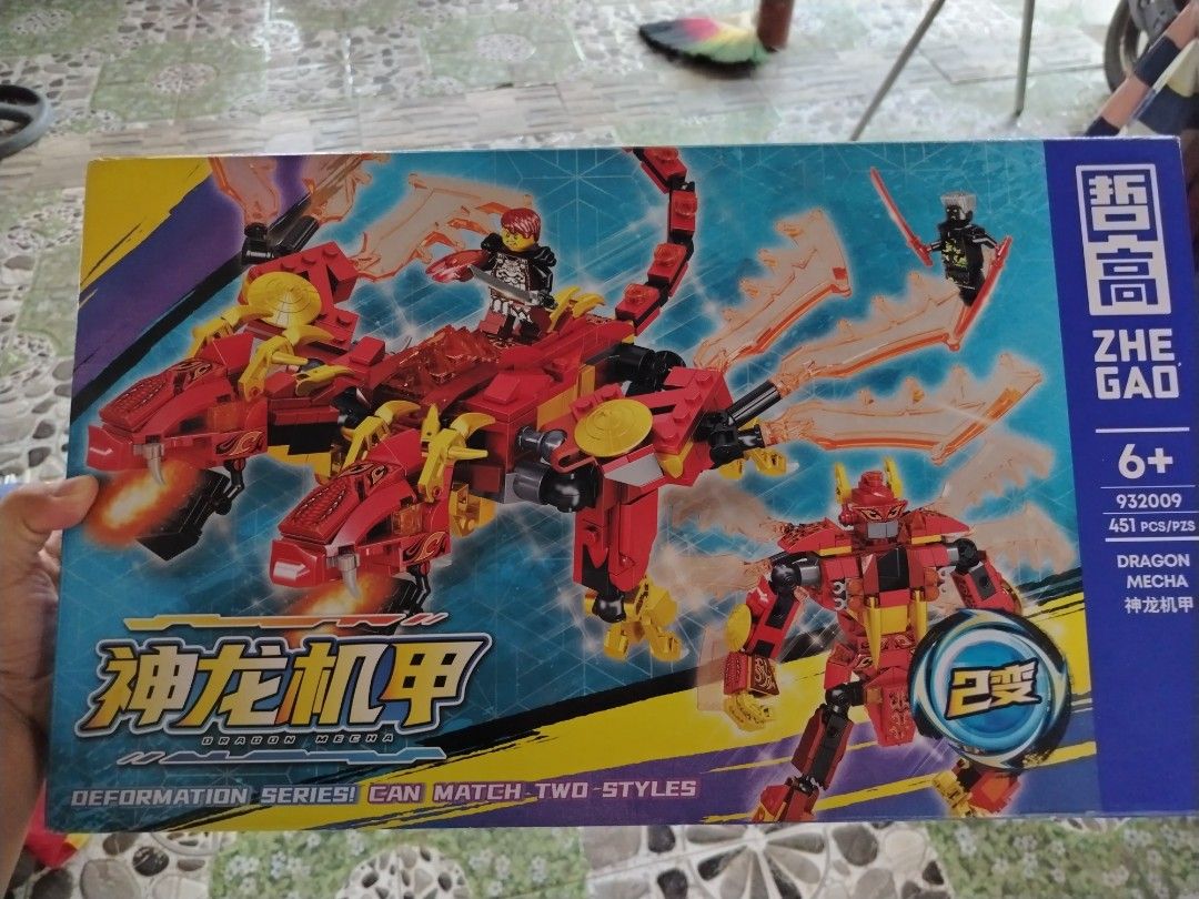 Zhe Gao Dragon Mecha Building Blocks Set (Category: Lego & Building Sets) located in Tayasan. Submitted by _raceprettyconcept (Listing ID 1408748408, Image 2). Description: - Zhe Gao Dragon Mecha Building Block Set - Transforms into 2 styles - 451 pieces - Suitable for ages 6+ - Features a red and yellow mecha and dragon - Part of the Deformation Series.