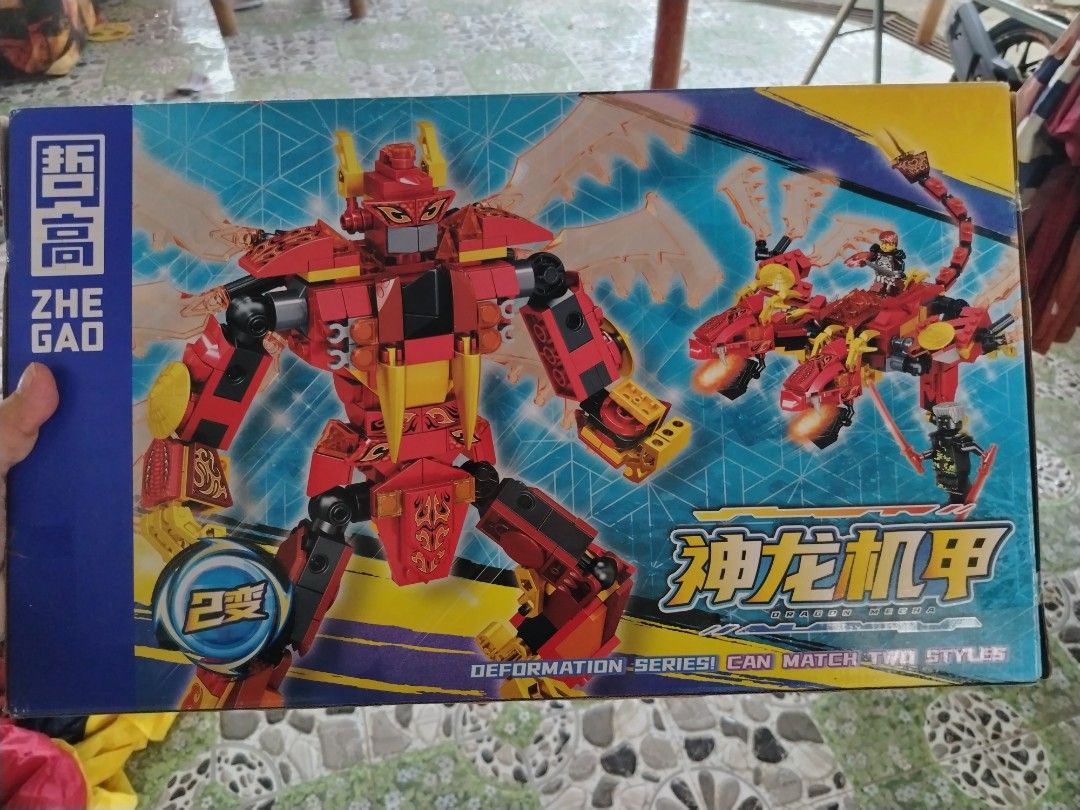 Zhe Gao Dragon Mecha Building Blocks Set (Category: Lego & Building Sets) located in Tayasan. Submitted by _raceprettyconcept (Listing ID 1408748408, Image 1). Description: - Zhe Gao Dragon Mecha Building Block Set - Transforms into 2 styles - 451 pieces - Suitable for ages 6+ - Features a red and yellow mecha and dragon - Part of the Deformation Series.