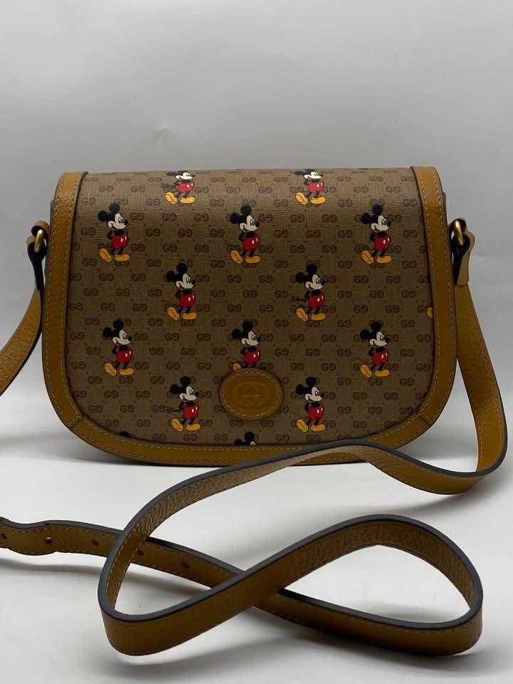 Authentic Gucci (Category: Luxury Bags & Wallets) located in Manila. Submitted by chloe_luxuries (Listing ID 1350689840, Image 1). Description: Guaranteed original Disney X Gucci Flap crossbody bag Still in excellent condition No inclusion bag only Pm for more details .
