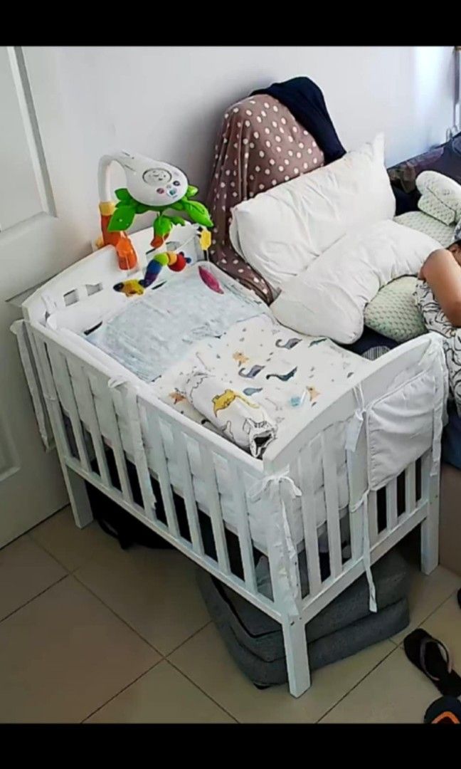 Custom-height Wooden Crib (Category: Cots & Cribs) located in Malabon City. Submitted by j.a.rubio (Listing ID 1350559245, Image 2). Description: Custom-height Wooden Crib with Uratex Foam bought @SM Baby ShopLzd for 6,393 24 x 40 in beddings not included color victoria white.