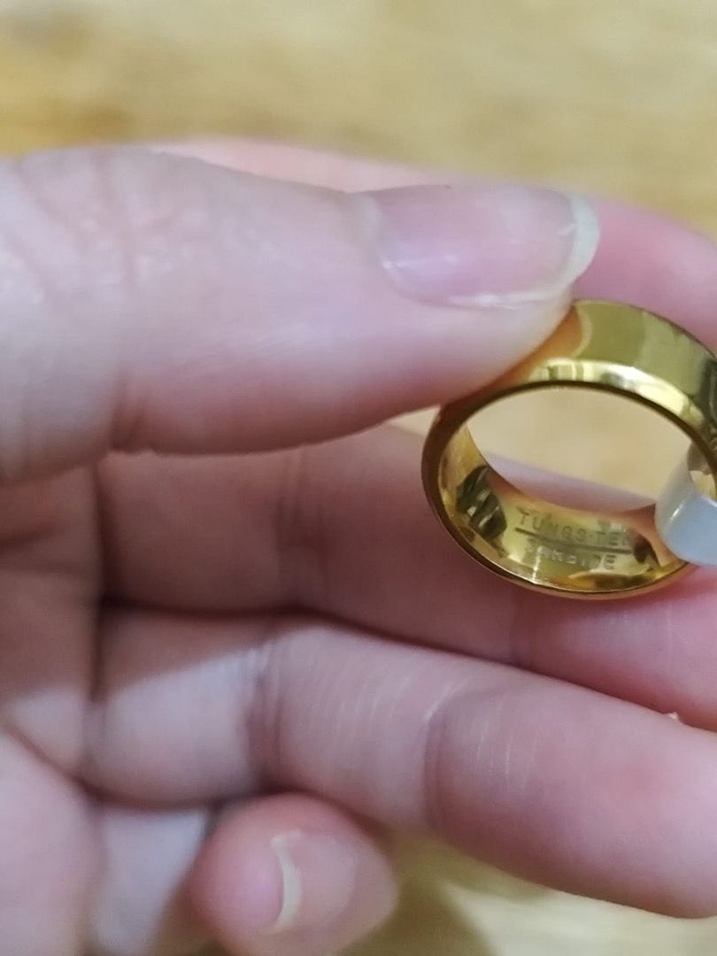HIGH QUALITY Gold Tungsten Wedding Ring (Category: Rings) located in Mandaluyong City. Submitted by allaboutgemsandco (Listing ID 1350709247, Image 3). Description: HIGH QUALITY Gold Tungsten Wedding Ring Ring Size: 6, with marking Price: Php 700 Minimum order: Php 500 REASON FOR SALE: Clearing out my collection. Selling it at 70% off the price I bought from Hongkong FACTS * Super Hard: Tungsten carbide is one of the hardest metals on earth, seco