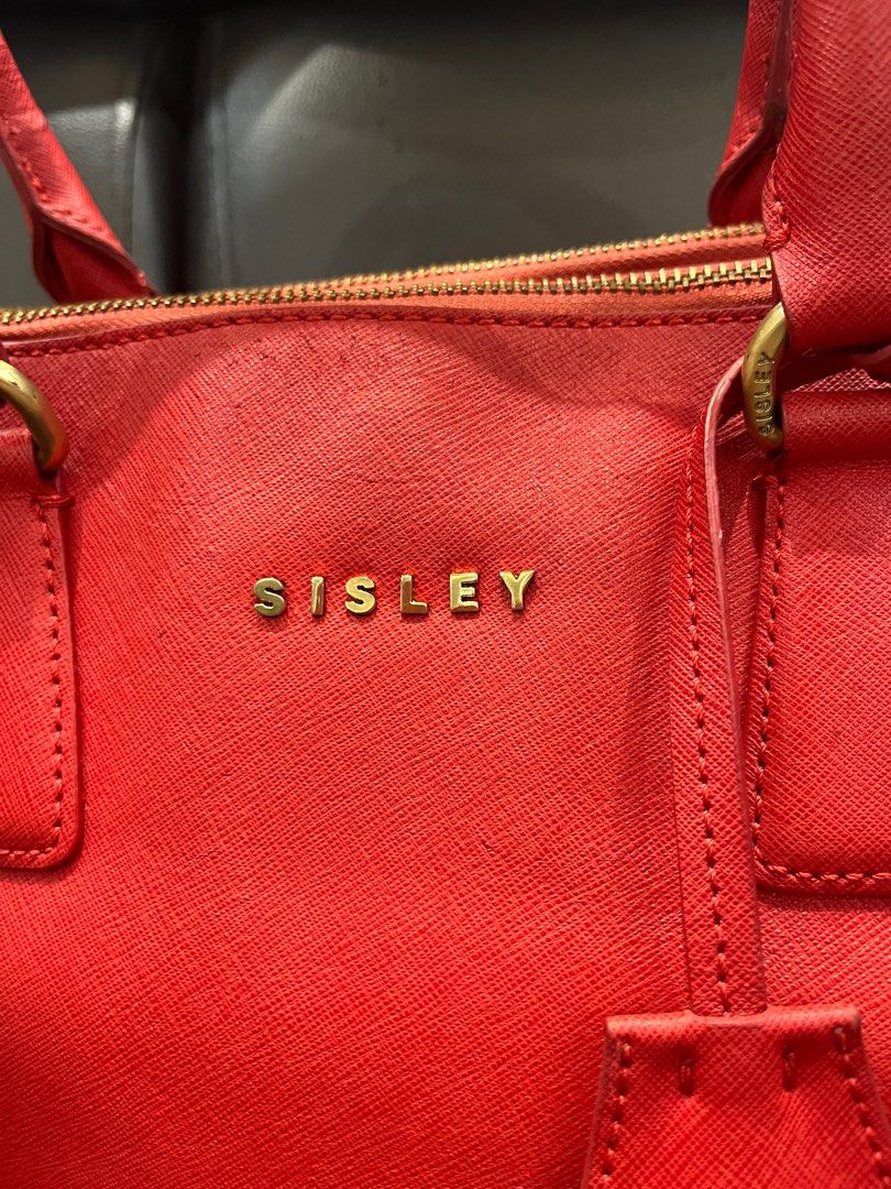 Sisley Red Two-Way Handbag Tote Bag (Category: Luxury Bags & Wallets) located in Makati City. Submitted by yumiiichigo (Listing ID 1350640428, Image 2). Description: dm for more info ❤️ signs of usage metal hardware.