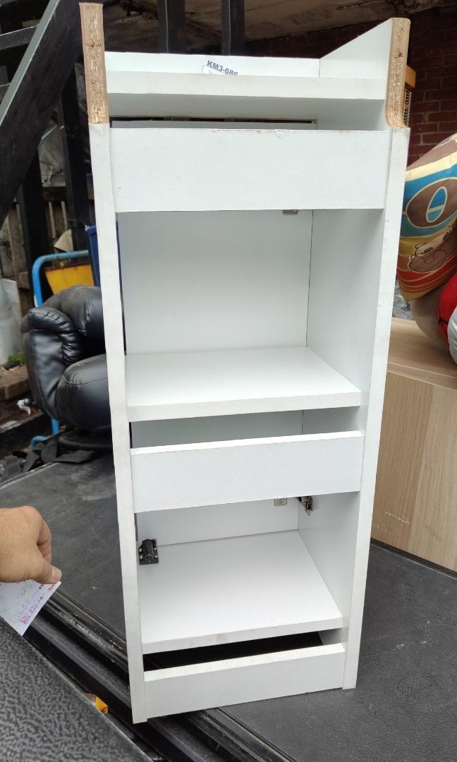 Cabinet small white wooden shelf (Category: Shelves, Cabinets & Racks) located in Manila. Submitted by rossinicalabig (Listing ID 1352262836, Image 2). Description: 400 Pesos only. Door & hinges working properly. Check all pics for condition. AS IS CONDITION. Check & pickup at our photo-video studio in Sta.Mesa.Mla. STUDIO J..