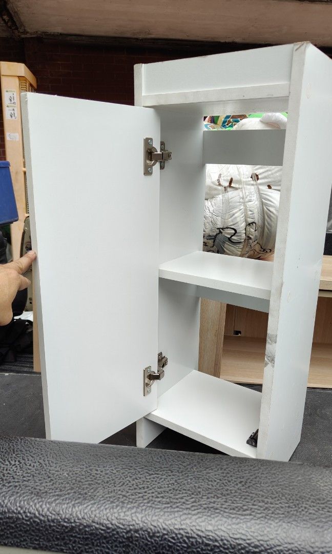 Cabinet small white wooden shelf (Category: Shelves, Cabinets & Racks) located in Manila. Submitted by rossinicalabig (Listing ID 1352262836, Image 1). Description: 400 Pesos only. Door & hinges working properly. Check all pics for condition. AS IS CONDITION. Check & pickup at our photo-video studio in Sta.Mesa.Mla. STUDIO J..
