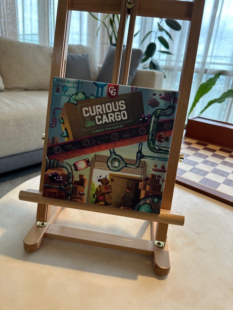 Curious Cargo 2-player Boardgame - Ready to Ship Goods? (Category: Board Games & Puzzles) located in Mandaluyong City. Submitted by jpetrulli (Listing ID 1352230932, Image 2). Description: Looking for a quirky and strategic two-player game? Curious Cargo, designed by Ryan Courtney (Pipeline), is a unique logistics and tile-laying game where you build conveyor belts, ship goods, and outmaneuver your opponent. With its deep strategy and engaging he