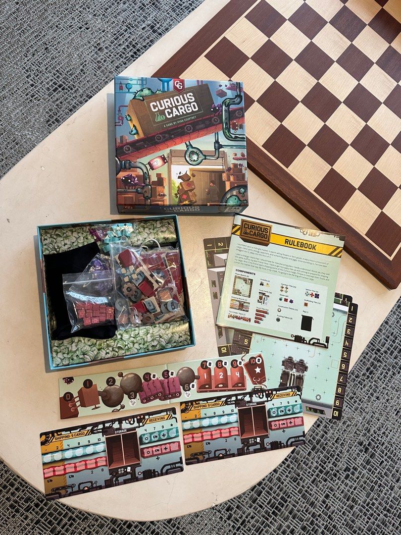 Curious Cargo 2-player Boardgame - Ready to Ship Goods? (Category: Board Games & Puzzles) located in Mandaluyong City. Submitted by jpetrulli (Listing ID 1352230932, Image 3). Description: Looking for a quirky and strategic two-player game? Curious Cargo, designed by Ryan Courtney (Pipeline), is a unique logistics and tile-laying game where you build conveyor belts, ship goods, and outmaneuver your opponent. With its deep strategy and engaging he