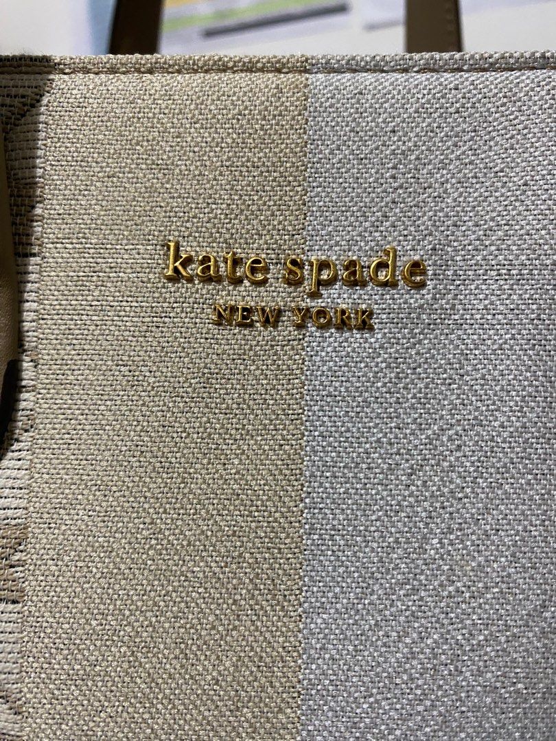 Kate Spade Manhattan Tote Bag (Category: Luxury Bags & Wallets) located in Zamboanga. Submitted by zamboutique (Listing ID 1352242974, Image 3). Description: Kate Spade Flower Jacquard Stripe Manhattan Small Tote Bag. Bought for PHP 24,525 last 2023 from Shangri-La. Complete. With receipt, dust bag. Will include paper bag if i find it 😁 THE DETAILS * Twill fabric with smooth leather trim * Faille lining * Plaque logo * Imported * Tote with open 