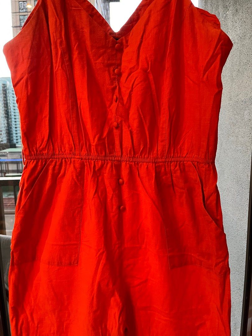 Orange jumpsuit (Category: Jumpsuits) located in Makati City. Submitted by messbless (Listing ID 1352268173, Image 2). Description: - Buttons are slightly loose due to wash. - One button is missing (by the waistline). - No belt included - Delivery and booking care of buyer.