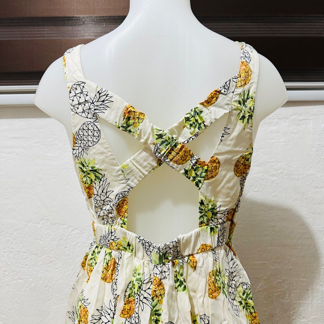 Pineapple Summer Dress (Category: Dresses) located in Calamba. Submitted by zybellezone (Listing ID 1352260509, Image 2). Description: Fits medium to large Criss cross back Double lining Minor flaw: hole in the inner lining, not seen when worn since it is inside.
