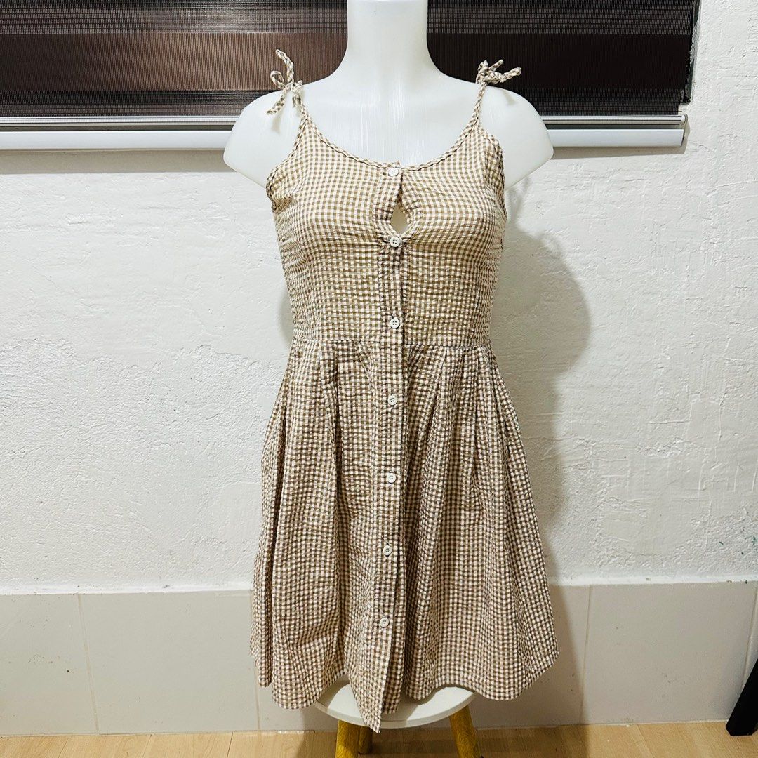 Plaid Checkered Brown Button Down Dress (Category: Dresses) located in Calamba. Submitted by zybellezone (Listing ID 1352257671, Image 1). Description: Fits small to semi med Ideal for flat chested ladies.