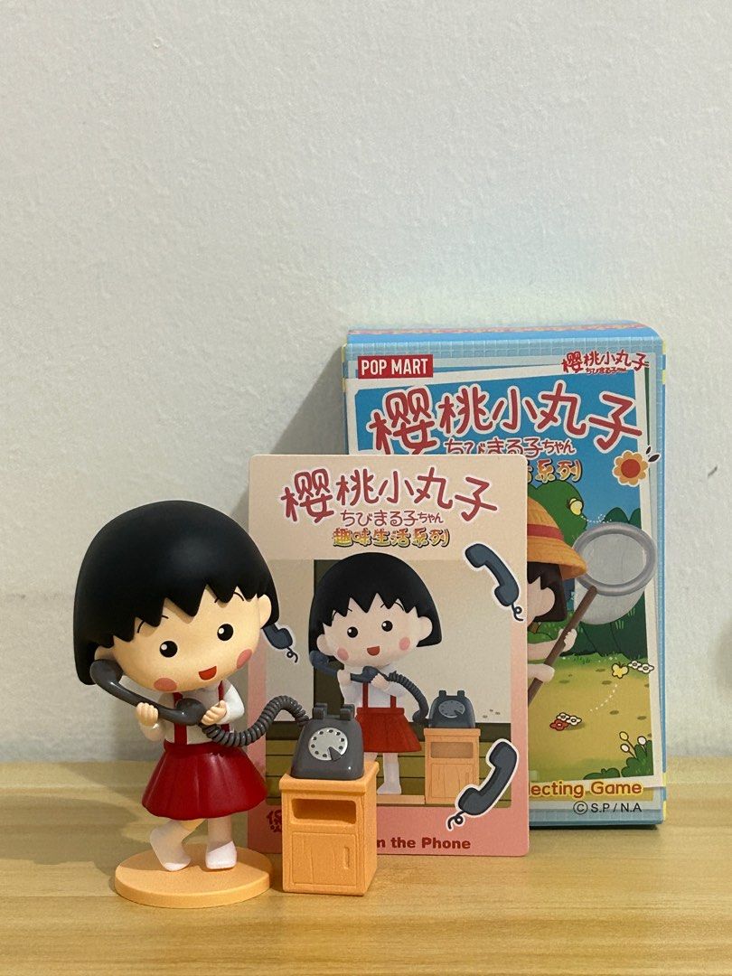 Pop Mart- Chibi Maruko Chan (Category: Designer & Blind Box Toys) located in Alfonso. Submitted by vern1996 (Listing ID 1352212253, Image 1). Description: Chibu Maruko Chan- Talking on the Phone W card, box and foil .