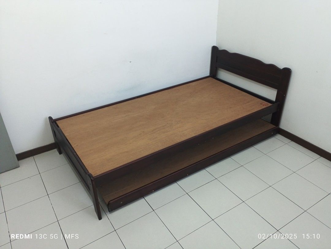 Solid Wood Single Bed (Category: Bed Frames & Mattresses) located in Johor Bahru. Submitted by infamousfame (Listing ID 1352217892, Image 2). Description: Single Bed with additional pull out frame. Capacity untuk 2 pax, sesuai untuk ruang yang terhad. Sesuai digunakan dari kanak-kanak berusia 4 tahun hingga dewasa. Kayu kukuh dan tahan lasak. Berukuran 77 inci x 41 inci. Jual sebab tidak digunakan. Self pick up di area Iskandar Puteri..