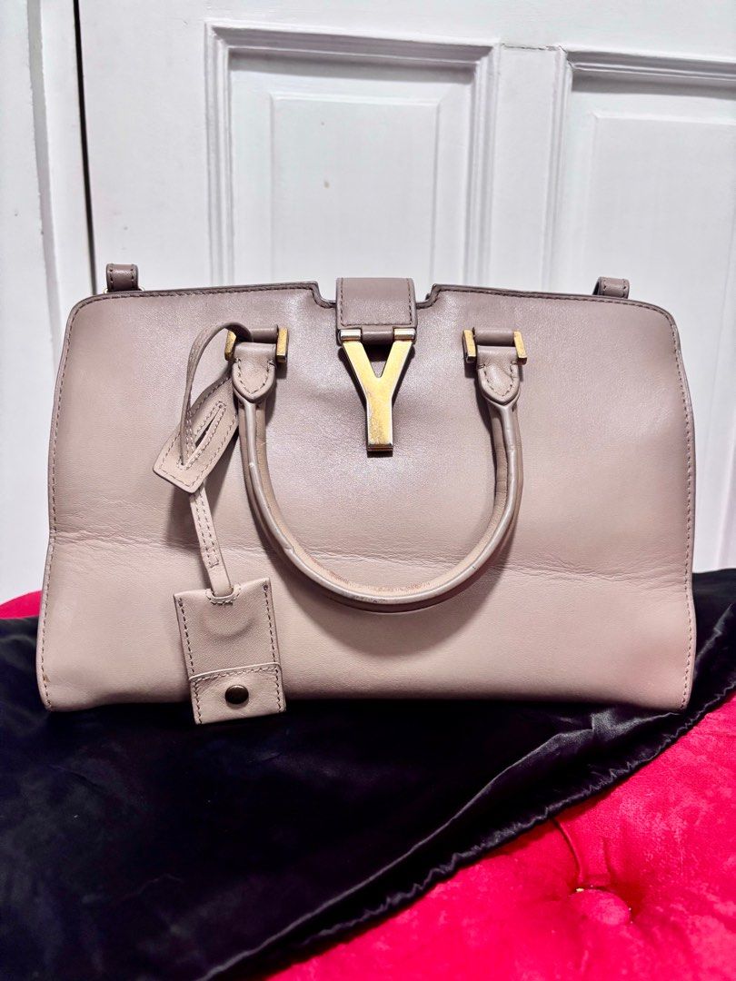 Yves Saint Laurent - Cabas Chyc Classic Y (Category: Luxury Bags & Wallets) located in Quezon City. Submitted by crafted.by.eli (Listing ID 1352265170, Image 1). Description: Selling mom’s Authentic Pre Loved Yves Saint Laurent Cabas Chyc Classic Y Small – Nude Calfskin Leather 👜 🏷️Price: P 19,999 Hard-to-find color! Elegant and versatile 2-way bag. 🔘Condition: Good (No tears, clean interior) 🔘Flaws: Tarnished hardware, creases on the front, 