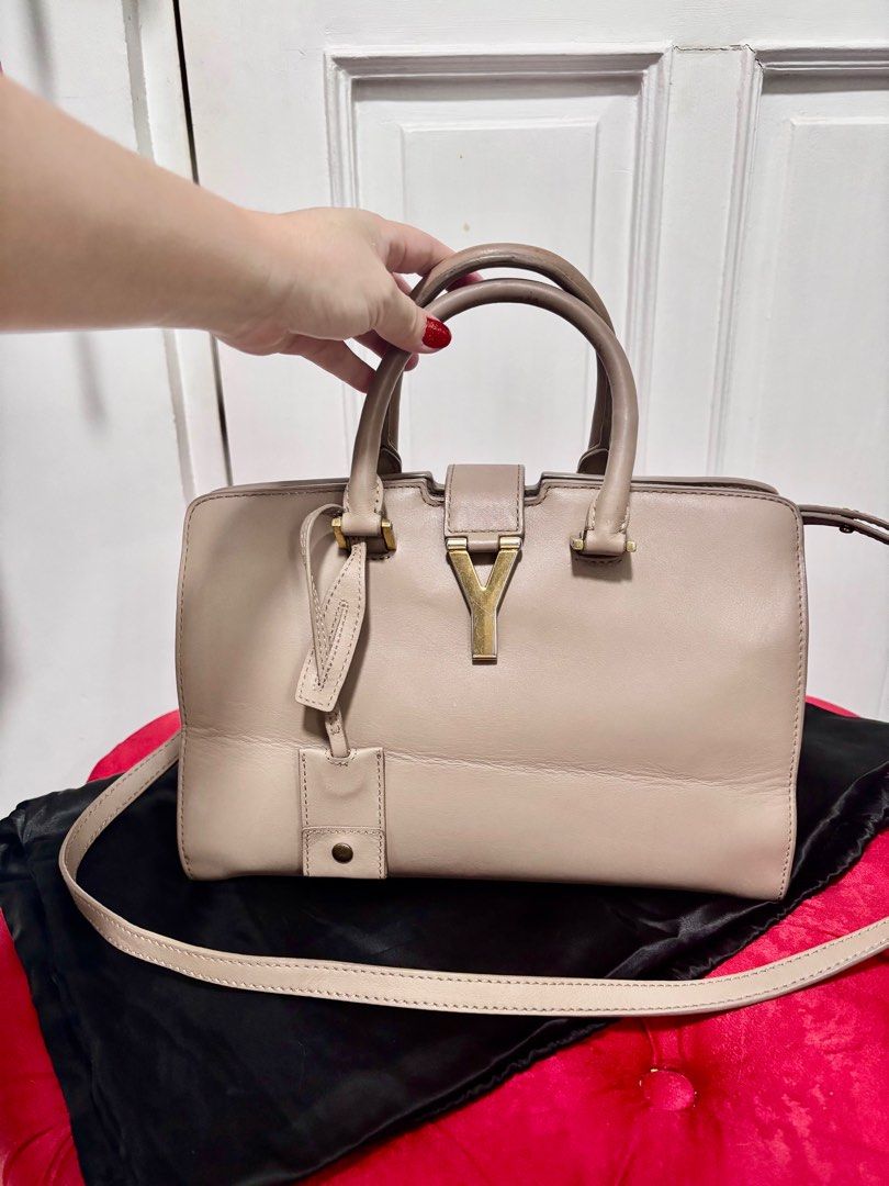 Yves Saint Laurent - Cabas Chyc Classic Y (Category: Luxury Bags & Wallets) located in Quezon City. Submitted by crafted.by.eli (Listing ID 1352265170, Image 3). Description: Selling mom’s Authentic Pre Loved Yves Saint Laurent Cabas Chyc Classic Y Small – Nude Calfskin Leather 👜 🏷️Price: P 19,999 Hard-to-find color! Elegant and versatile 2-way bag. 🔘Condition: Good (No tears, clean interior) 🔘Flaws: Tarnished hardware, creases on the front, 
