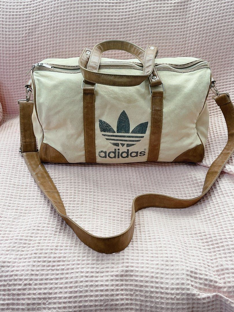 Adidas Canvas Travel Bag (Category: Cross-body Bags) located in Davao. Submitted by yukiloki (Listing ID 1352350677, Image 1). Description: With issue.