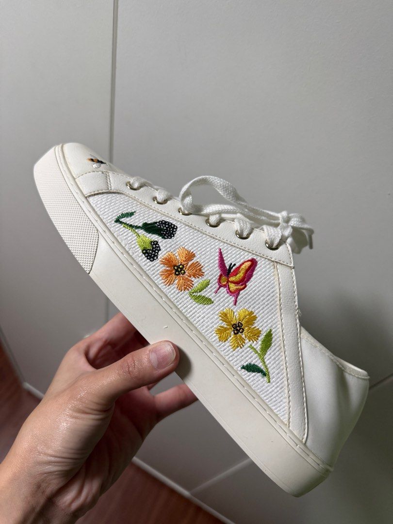 Aldo White Embroidered Sneakers (Category: Sneakers) located in Manila. Submitted by _rinaa (Listing ID 1352451444, Image 2). Description: Size: 10US Product Details • A pair of round toe white sneakers ,has Embroidered styling, • Lace-ups detail. • Textile upper • Cushioned footbed • Textured and patterned outsole Material & Care Textile Wipe with a clean, dry cloth when needed.