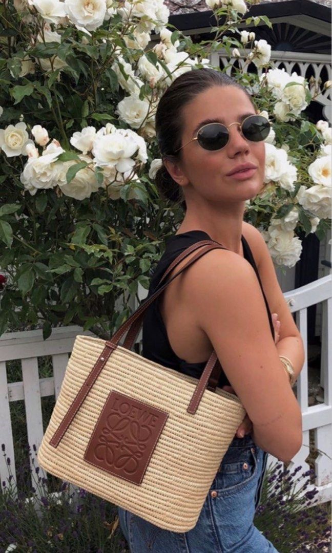 ⚜️Loewe Raffia Small Basket Tote bag (Category: Luxury Bags & Wallets) located in Makati City. Submitted by 90sangel (Listing ID 1352505095, Image 1). Description: •Item: Loewe Raffia Basket Bag 👜 •Size: Small 28cm x 21cm •Condition: Excellent! *Dreaming of an island in the sun? 🌴🏝️✨🫧Can you already hear the waves crashing against the shore? This whimsical basket bag from Loewe imbues the warm, fuzzy feelings of a summer holiday into one hand