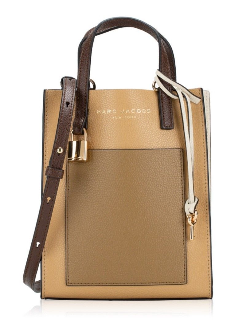 MARC JACOBS MICRO GRIND IN ICED COFFEE (Category: Luxury Bags & Wallets) located in Baguio. Submitted by vanityvixens_shop (Listing ID 1352430477, Image 1). Description: USED ONLY ONCE, LIKE NEW 💯AUTHENTIC ONHAND & READY TO SHIP US BOUGHT, TAG INCLUDED WITH BAG. Description 17cm (W) x 20cm (H) x 6cm (D) Structured silhouette with flat base for stability Leather Gold-tone hardware Lined Textile Imported.