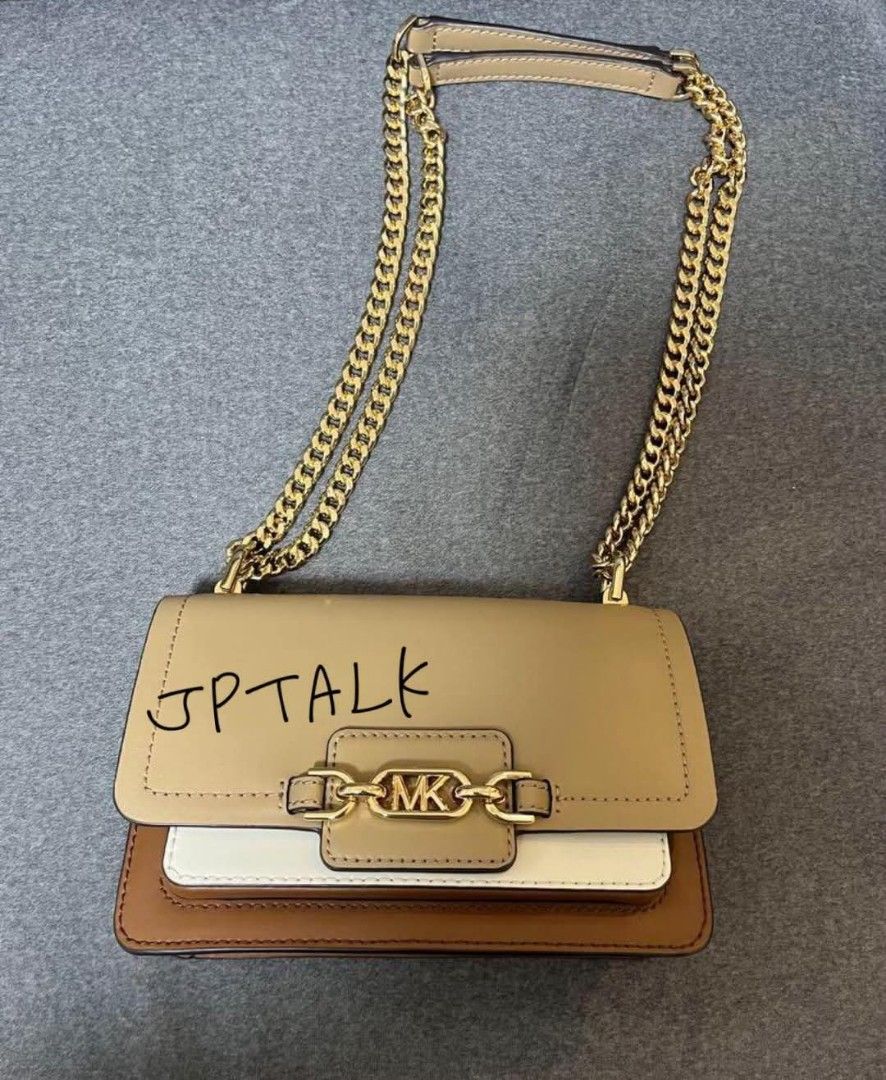 Original MK (Category: Luxury Bags & Wallets) located in Bulacan. Submitted by vintage_purge (Listing ID 1352518094, Image 1). Description: mk 4500php The chain can be worn either short or long. A stylish beige and brown leather shoulder bag with a chain strap. - Color: Beige/Brown/White - Material: Leather - Strap Type: Chain Strap - Interior: Two Compartments lets make reading a habit please ask us before proceeding into transactions we cater t