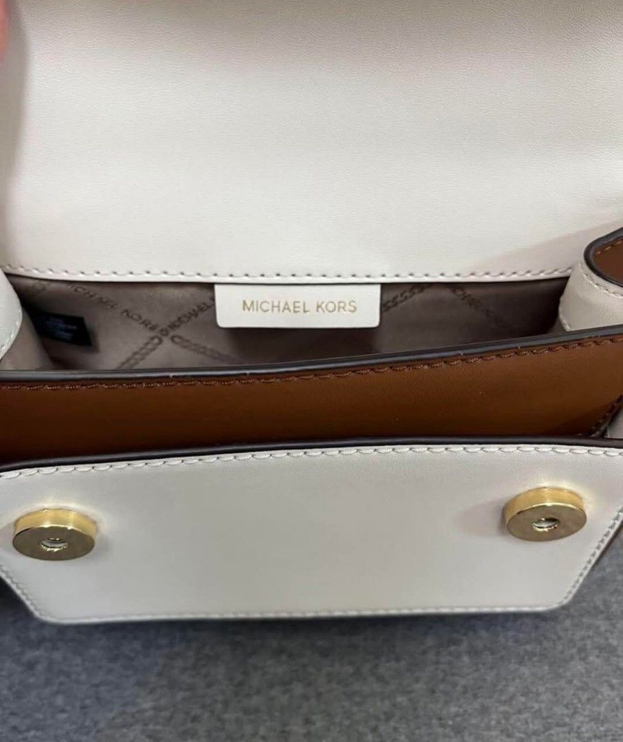 Original MK (Category: Luxury Bags & Wallets) located in Bulacan. Submitted by vintage_purge (Listing ID 1352518094, Image 3). Description: mk 4500php The chain can be worn either short or long. A stylish beige and brown leather shoulder bag with a chain strap. - Color: Beige/Brown/White - Material: Leather - Strap Type: Chain Strap - Interior: Two Compartments lets make reading a habit please ask us before proceeding into transactions we cater t