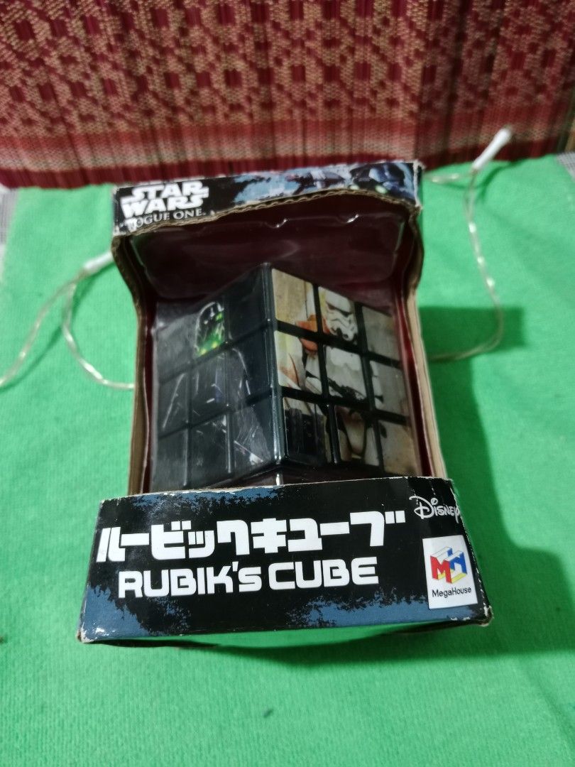 STAR WARS Rogue One RUBIK'S CUBE ver. (Category: Board Games & Puzzles) located in Tabaco. Submitted by fritznicoleshoppe (Listing ID 1352449612, Image 3). Description: STAR WARS Rogue One RUBIK'S CUBE ver. Good as new. Complete with box and stand. Highly collectible item. * buyer can avail the FREEBIES listed.