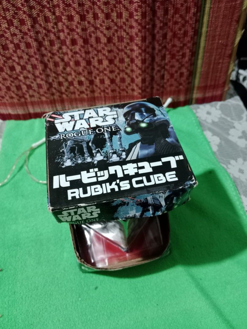 STAR WARS Rogue One RUBIK'S CUBE ver. (Category: Board Games & Puzzles) located in Tabaco. Submitted by fritznicoleshoppe (Listing ID 1352449612, Image 2). Description: STAR WARS Rogue One RUBIK'S CUBE ver. Good as new. Complete with box and stand. Highly collectible item. * buyer can avail the FREEBIES listed.