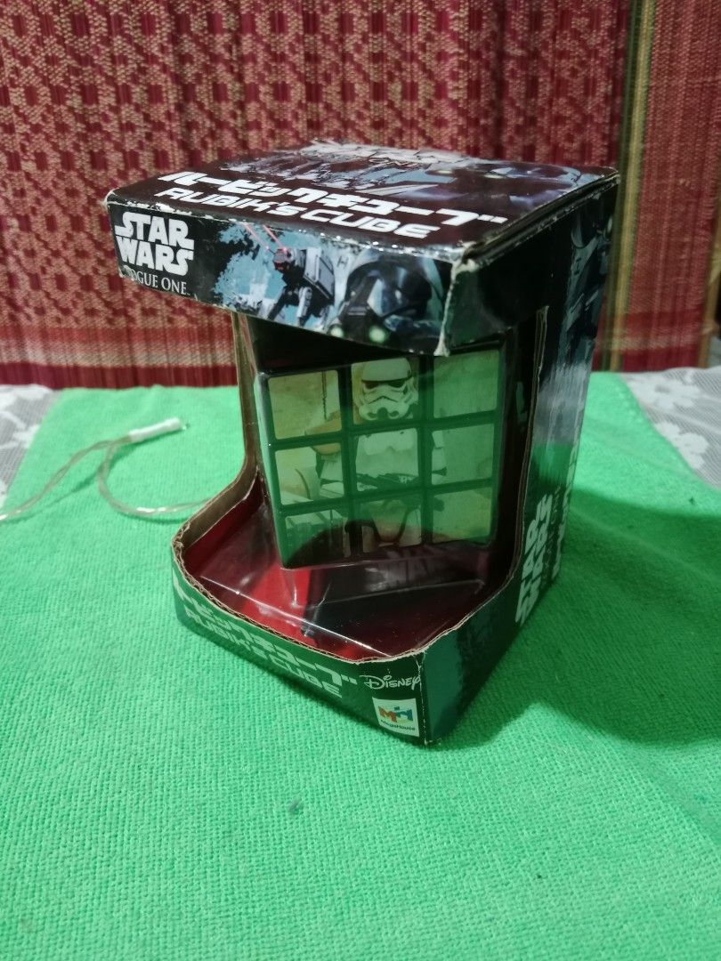 STAR WARS Rogue One RUBIK'S CUBE ver. (Category: Board Games & Puzzles) located in Tabaco. Submitted by fritznicoleshoppe (Listing ID 1352449612, Image 1). Description: STAR WARS Rogue One RUBIK'S CUBE ver. Good as new. Complete with box and stand. Highly collectible item. * buyer can avail the FREEBIES listed.