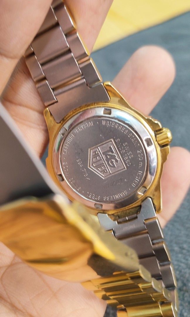 Tag Heuer Proffesional 200M (Category: Women's Watches) located in Manila. Submitted by kenthrift2000 (Listing ID 1352453680, Image 3). Description: Model: 4000 994.708A Movement: Quartz Functions: Hours, minutes, seconds, and date Case Size: 28mm Case Material: 18K Gold Plated Bezel: Turning Bezel Steel Strap/Bracelet: Gold-tone, 127mm or 154mm inner length Water Resistance: 200 meters [Text from image] Crystal: Sapphire Dial: Champagne Unit onl