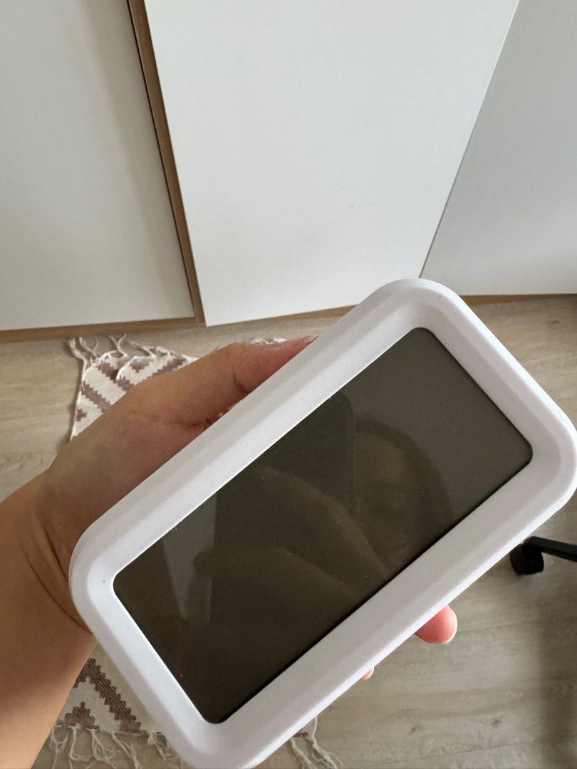 Digital clock (Category: Clocks) located in Singapore. Submitted by orangepillow (Listing ID 1352594213, Image 1). Description: White smart digital desk clock, like new. Letting it go as it didn’t match my home decor. Displays time, date, and features a snooze alarm..