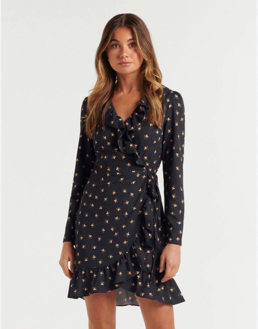 forever new chrissy wrap skater dress (Category: Dresses) located in Angeles City. Submitted by thriftchic_ (Listing ID 1352605315, Image 1). Description: - no issue! - a flouncy, feminine mini dress from work to weekend - plunging v neckline with ruffle trim - full length sleeves - removable waist tie - flowing mini skirt with assymetrical flounce hem - lined - fit l-xl Note: - item is in good condition - color may appear brighter or darker due 