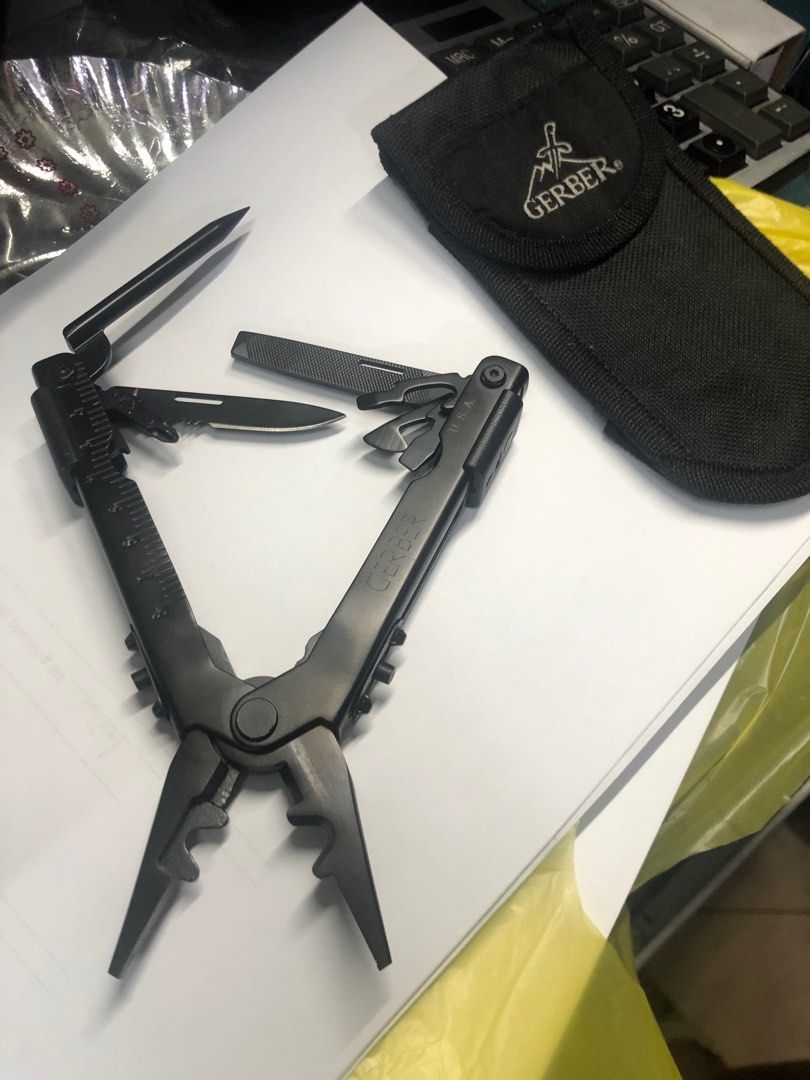 Gerber Multitool (Category: Construction Tools & Equipment) located in Pasig City. Submitted by wild_rex_blaza (Listing ID 1352530836, Image 3). Description: Gerber Multi tool Black heavy duty Legit.Preloved. Brand new. With sheath case 989 pesos Reason for selling: decluttering collection .