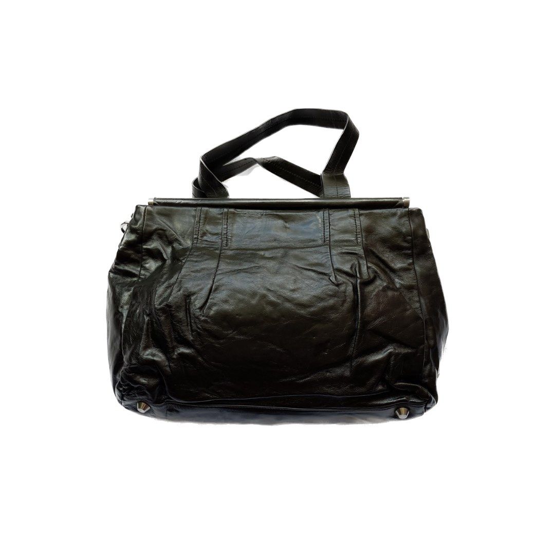 Miu Miu silver bow leather shoulder/handbag (Category: Luxury Bags & Wallets) located in Makati City. Submitted by ullox (Listing ID 1352602839, Image 2). Description: Miu Miu silver bow leather shoulder/handbag silver hardware Buttons on the side to make the bag bigger/ smaller 1 zipper inside pocket, 2 inside pocket Newly conditioned LasPiñas loc issue: missing strap.