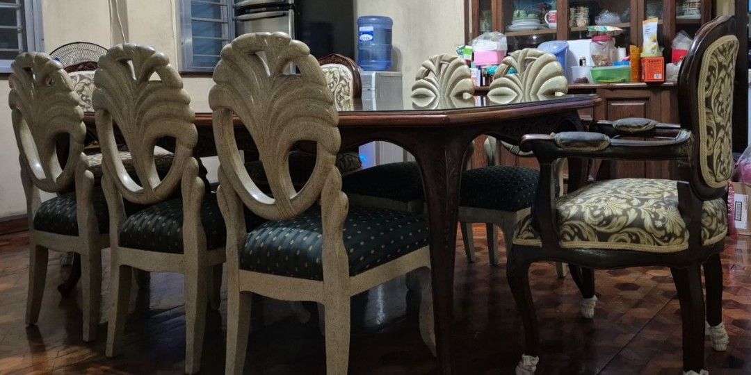 Antique furniture (Category: Tables & Sets) located in Caloocan City. Submitted by cleanup_clutter (Listing ID 1352867199, Image 1). Description: antique dining set 8 chairs and 8 seater dining table. the chairs are 2 different styles of carved mahogany and narra..
