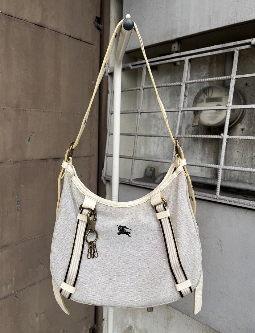 Burberry Blue Label Canvas 2-Way Shoulder Bag (Category: Luxury Bags & Wallets) located in Quezon City. Submitted by forgarments (Listing ID 1352729606, Image 1). Description: Burberry Blue Label Canvas 2-Way Shoulder Bag Excellent Condition Width: 13.5 Inches Height: 9 Inches Depth: 5.5 Inches Top handle: adjustable Versatile canvas shoulder bag with an adjustable strap for crossbody or shoulder wear. Features signature Burberry detailing, inclu