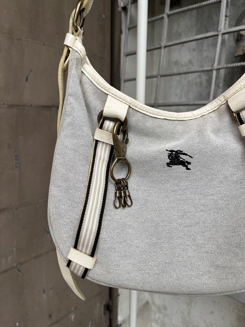 Burberry Blue Label Canvas 2-Way Shoulder Bag (Category: Luxury Bags & Wallets) located in Quezon City. Submitted by forgarments (Listing ID 1352729606, Image 3). Description: Burberry Blue Label Canvas 2-Way Shoulder Bag Excellent Condition Width: 13.5 Inches Height: 9 Inches Depth: 5.5 Inches Top handle: adjustable Versatile canvas shoulder bag with an adjustable strap for crossbody or shoulder wear. Features signature Burberry detailing, inclu