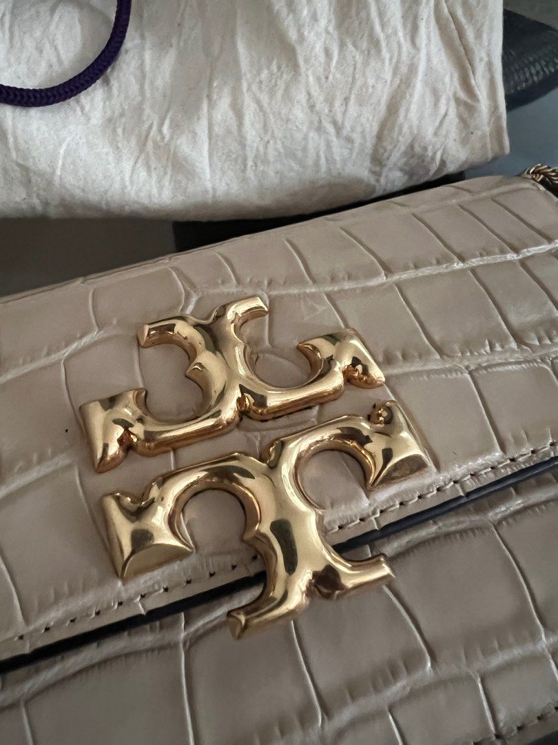 Tory Burch bag (Category: Purses & Pouches) located in Quezon City. Submitted by hometherapyph (Listing ID 1352731232, Image 1). Description: Barely used Tory bag with gold sling and dust bag .