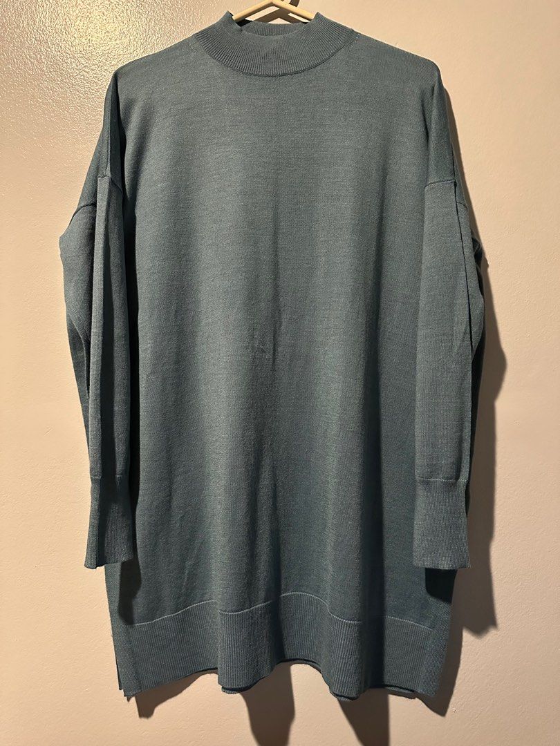 Uniqlo long top (Category: Longsleeves) located in Cainta. Submitted by annebc (Listing ID 1352814157, Image 1). Description: Color: Blue Gray Size: Medium Length: 31”.