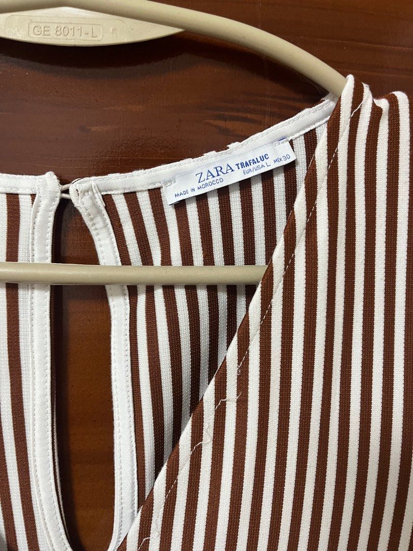 Authentic Zara Romper Brown/White FREE SF (Category: Others Tops) located in Caloocan City. Submitted by nishstudio (Listing ID 1352878668, Image 2). Description: Good as new. Authentic Zara Large on Tag Length-31 inchs Waist- 26-32 inchs So nice in actual Flaw as pictured sa may neckline sa stitching lang pero hindi halata and pwede tanggalin :) Soafer good buy huhu Rfs: DI NA KASYA :) J&T Shipping only. FREE NATIONWIDE :) .