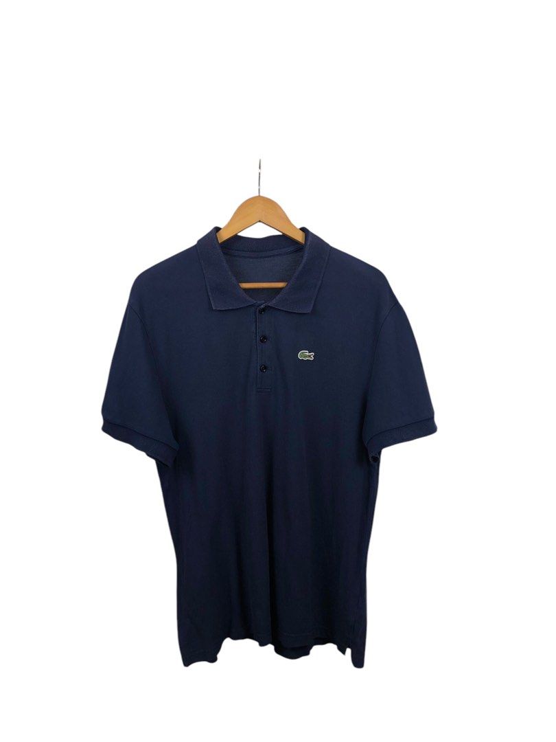 Lacoste Navy Blue Polo Shirt (Category: Tshirts & Polo Shirts ) located in Manila. Submitted by 12essentials (Listing ID 1352892806, Image 1). Description: 📌 Excellent Condition 📌 XL on tag 📌 Length 29’ Width 21’.