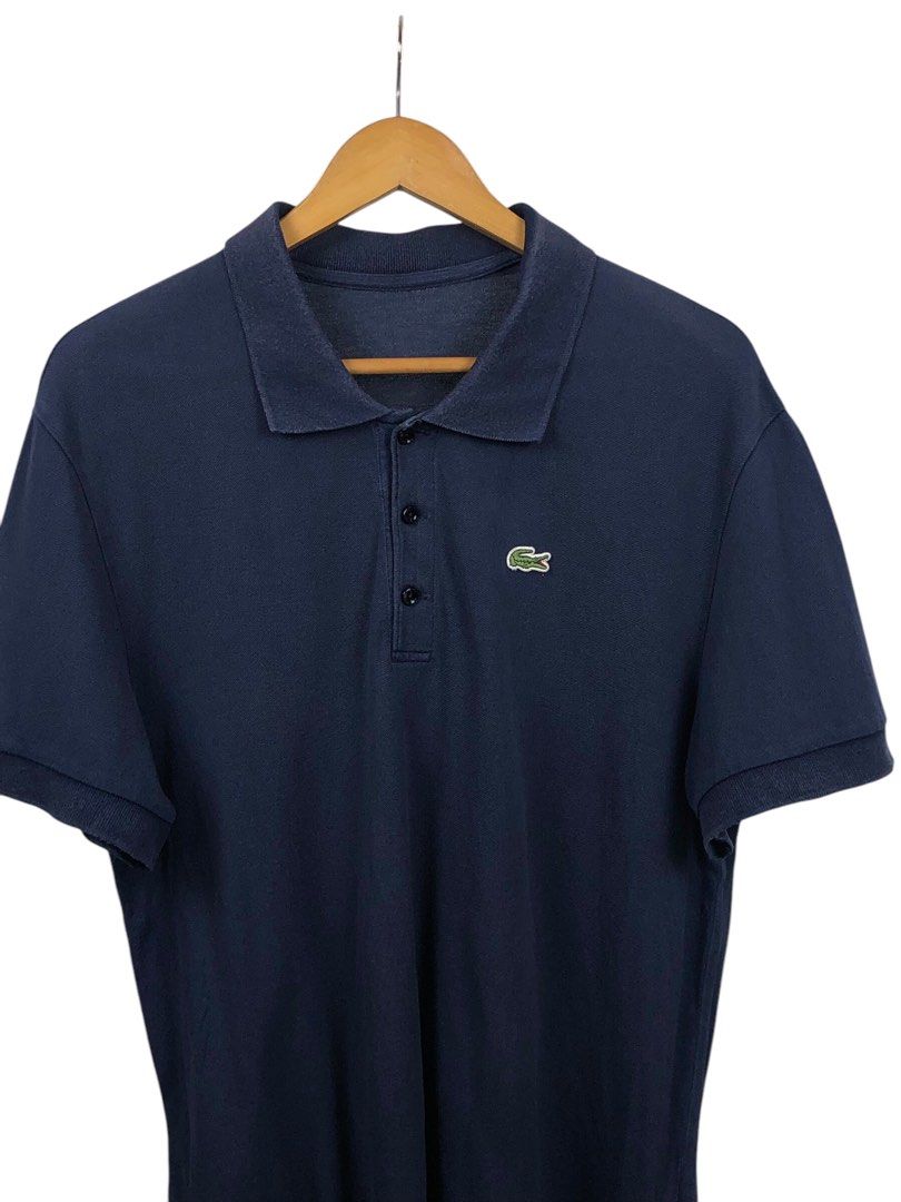 Lacoste Navy Blue Polo Shirt (Category: Tshirts & Polo Shirts ) located in Manila. Submitted by 12essentials (Listing ID 1352892806, Image 2). Description: 📌 Excellent Condition 📌 XL on tag 📌 Length 29’ Width 21’.